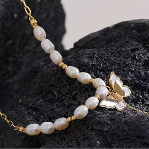 Stainless Steel, Natural Pearls
Gold and White Butterfly Pendant Necklace